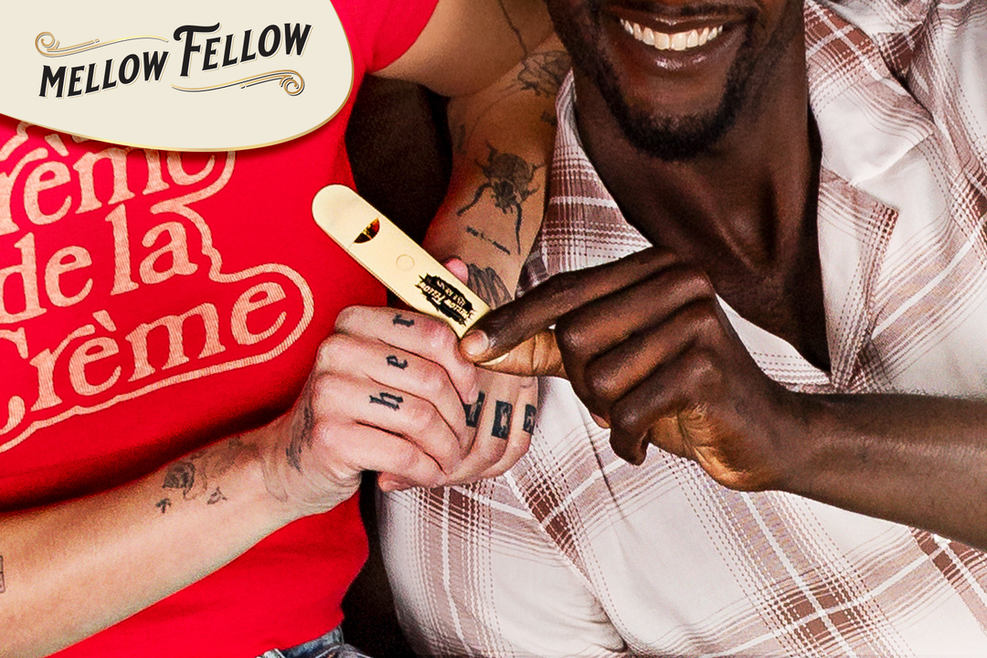 Two men, smiling and holding Mellow Fellow vape cartridges