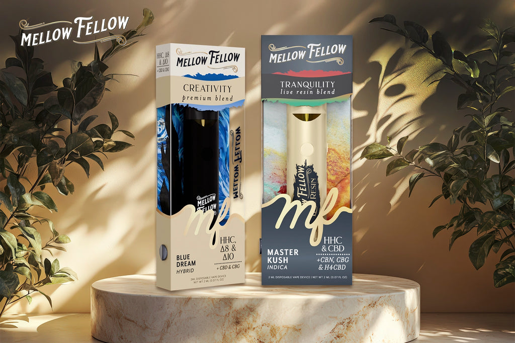 A Mellow Fellow CREATIVITY vape (Blue Dream flavour) and a TRANQUILITY vape (Master Kush flavour) placed on a marble disk