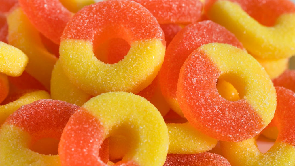Orange and yellow sugar-coated gummies