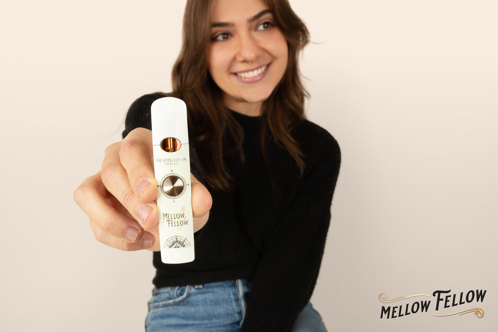 Woman holding a vape from Mellow Fellow