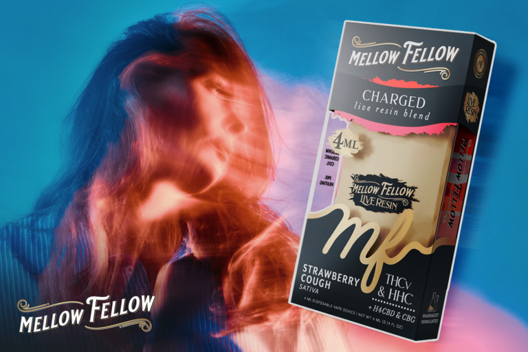 A person with flowing red hair beside a Mellow Fellow vape Charged live resin blend vape device with Strawberry Cough flavor on a blue background