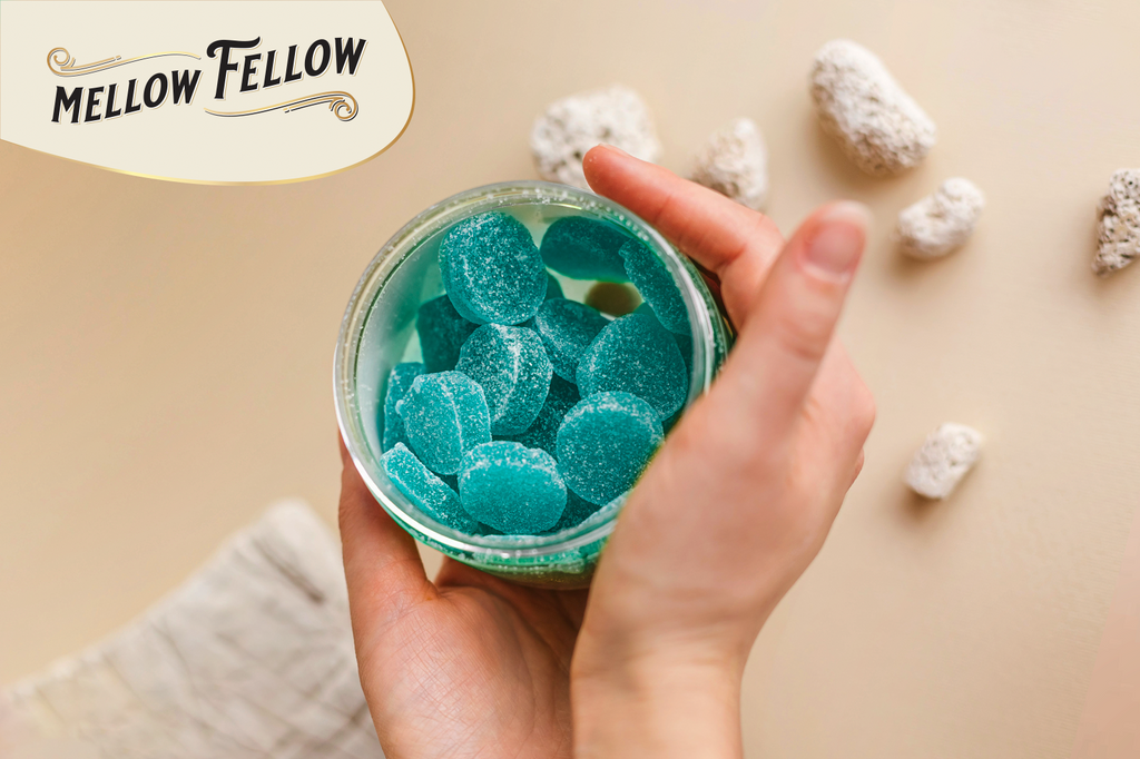 Woman's hands holding an open jar of Mellow Fellow gummies.