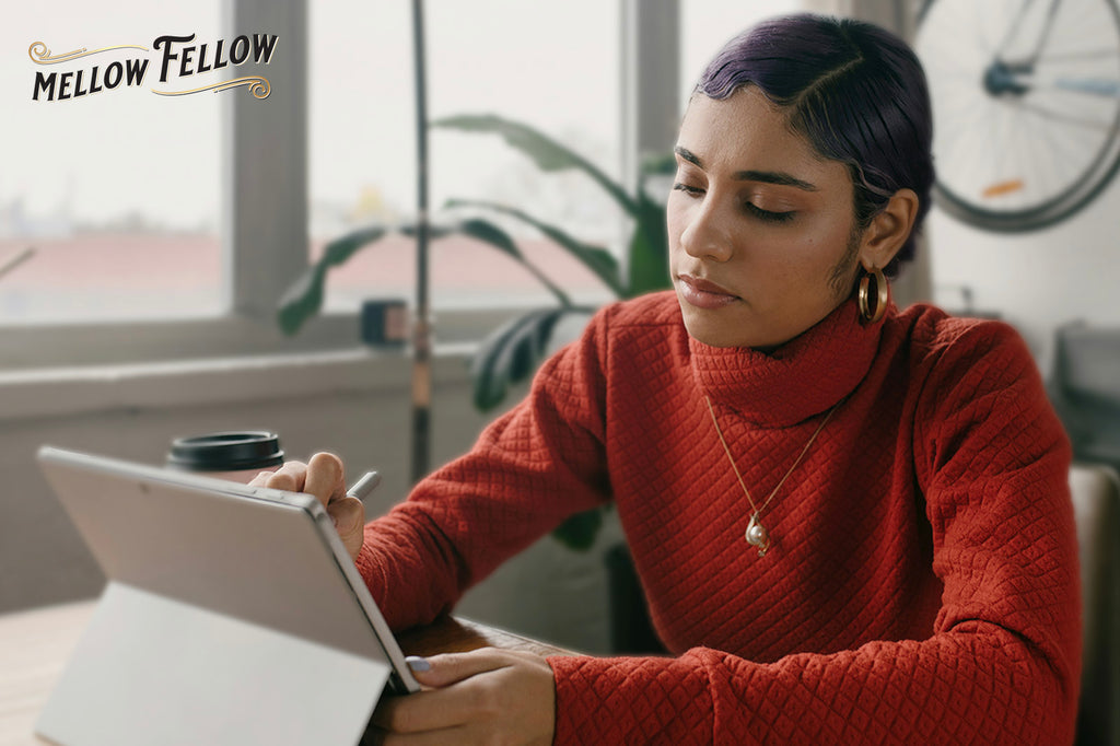 A lady working on her tablet and focusing on her work