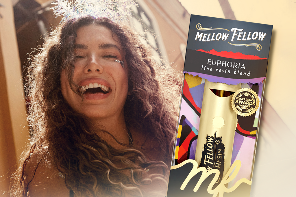 An image of a lady smiling alongside a Mellow Fellow EUPHORIA Live Resin Blend vape device