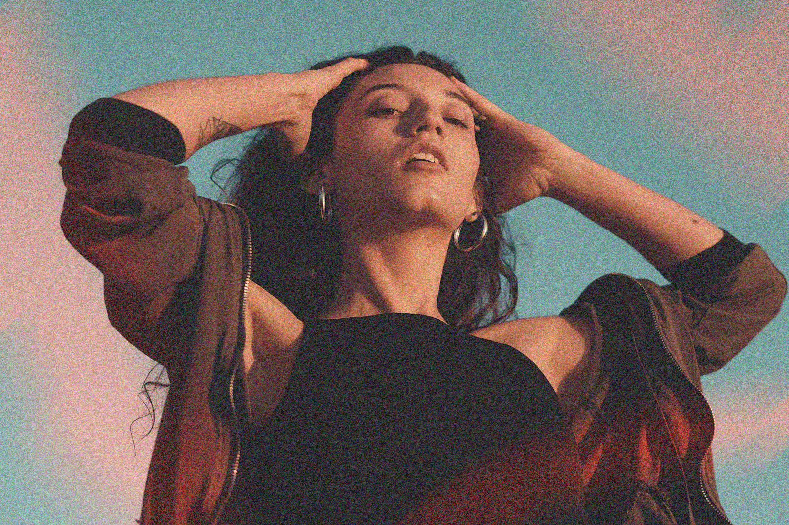 Woman with her hands on her head