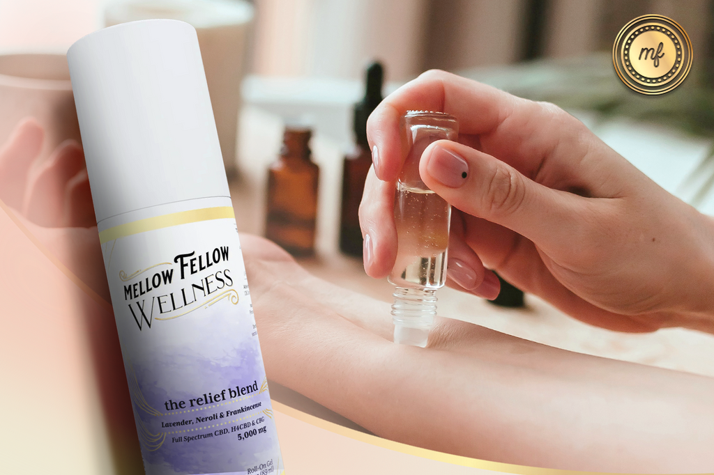 The Mellow Fellow WELLNESS Relief Blend Roll-On, flavored with Lavender, Neroli, and Frankincense, is applied by hand to the wrist