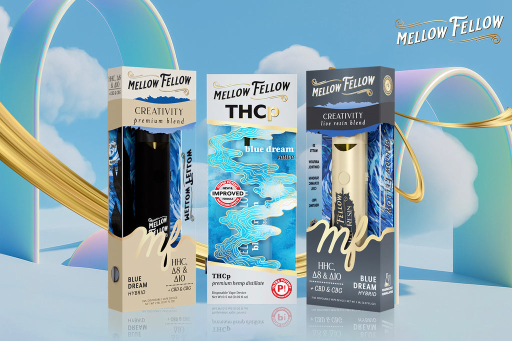 Three Blue Dream-flavored Mellow Fellow CREATIVITY & THCp disposable vape devices placed on a bluish surface
