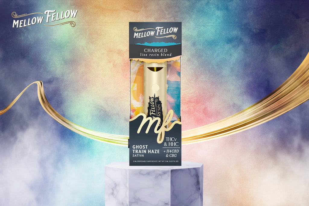 A Mellow Fellow CHARGED live resin blend vape device in Ghost Train Haze flavor, placed on a white marble pedestal against a bluish smoky background