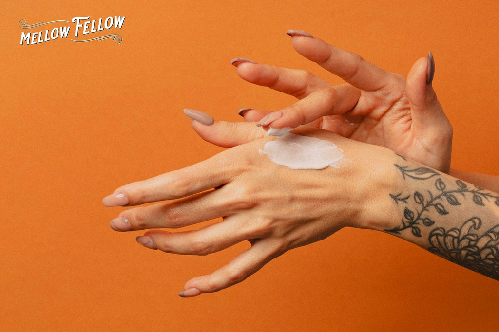 A lady applies CBD cream to her hand